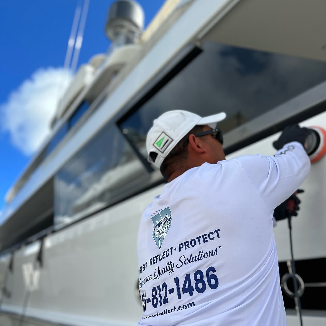 Correct Reflect technician machine polishing the hull of a superyacht in Miami, FL